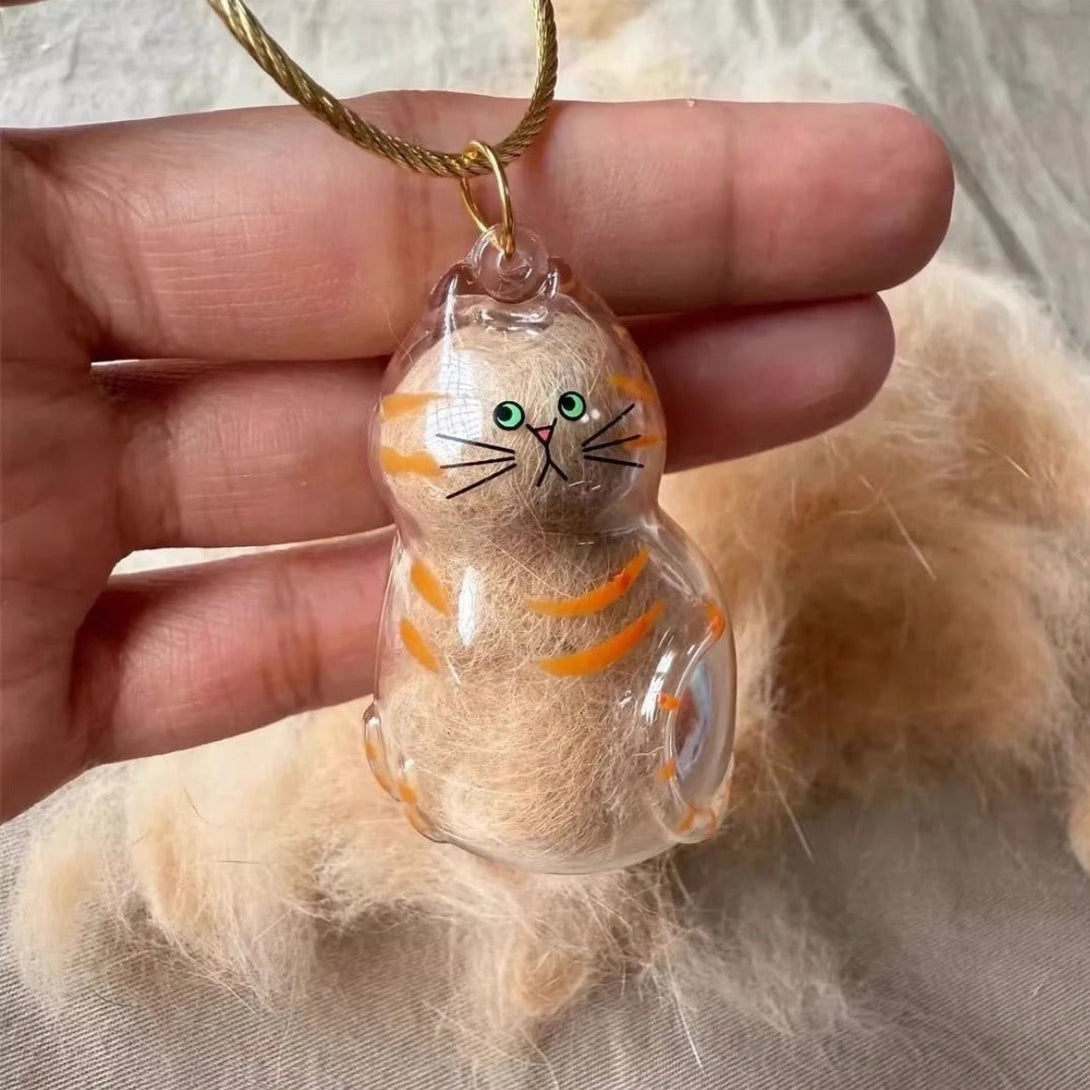 Cat Fur Keepsake Capsule Keychain with cat fur stored inside — memorial gift for cat moms and pet lovers.